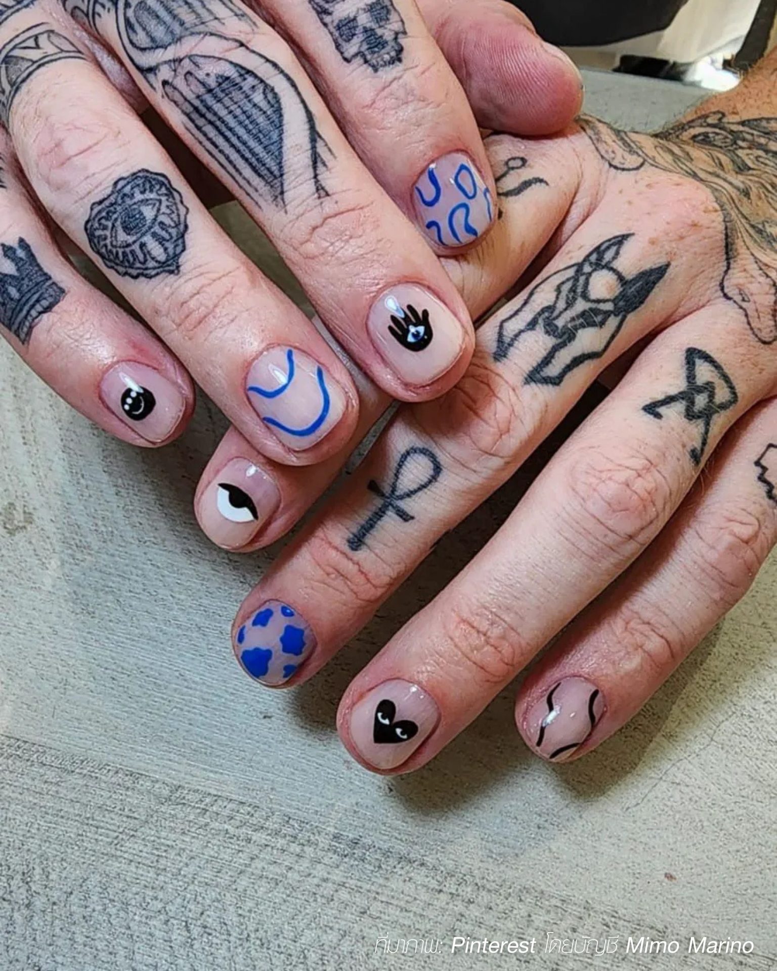 Street art men's nail ideas featuring hearts and edgy graphics