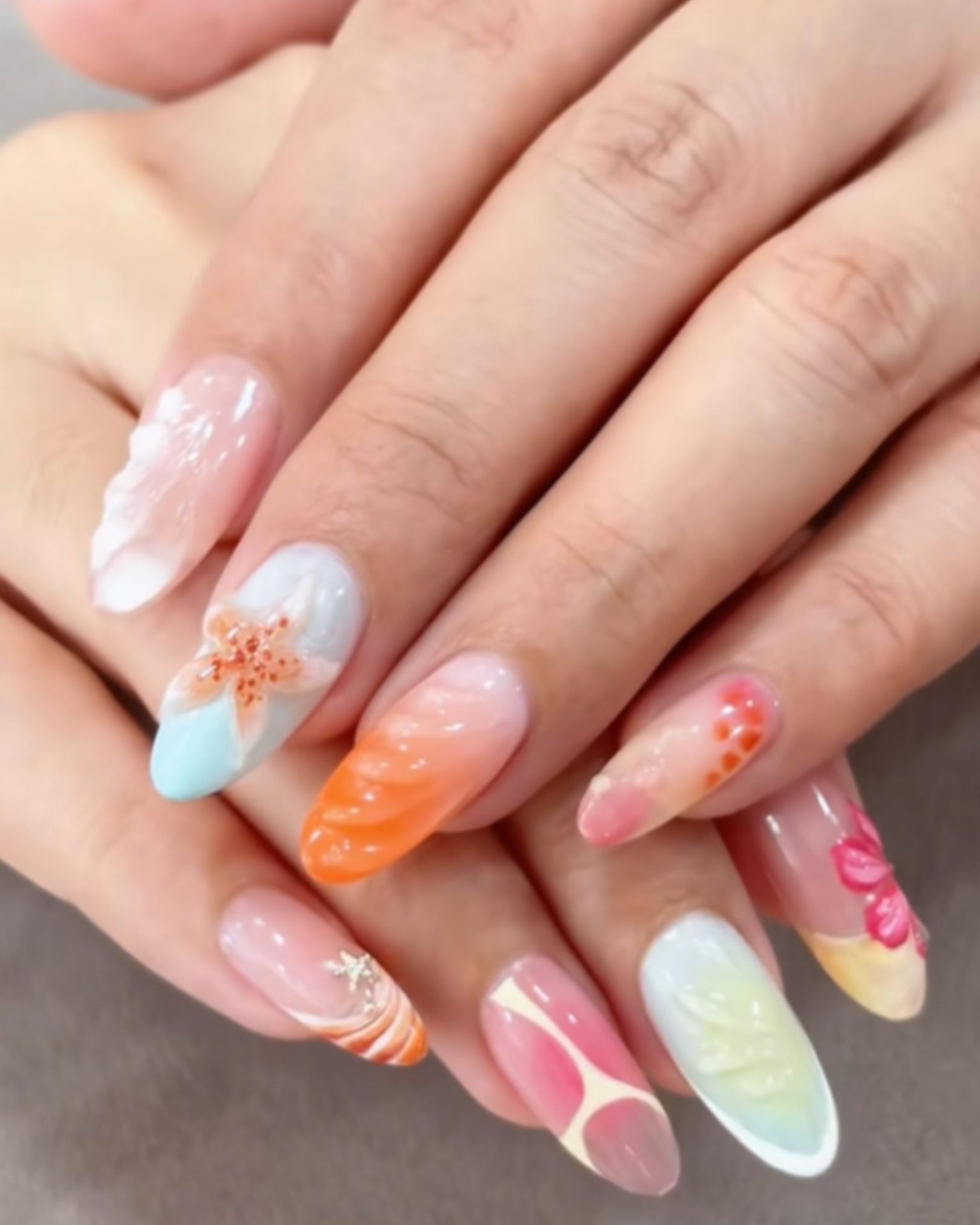Tropical theme nail art with starfish and bright colors
