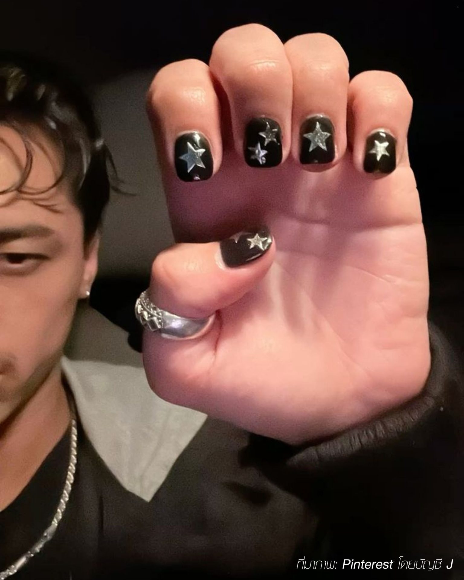 Standout chic men's nails with silver stars painted on black base