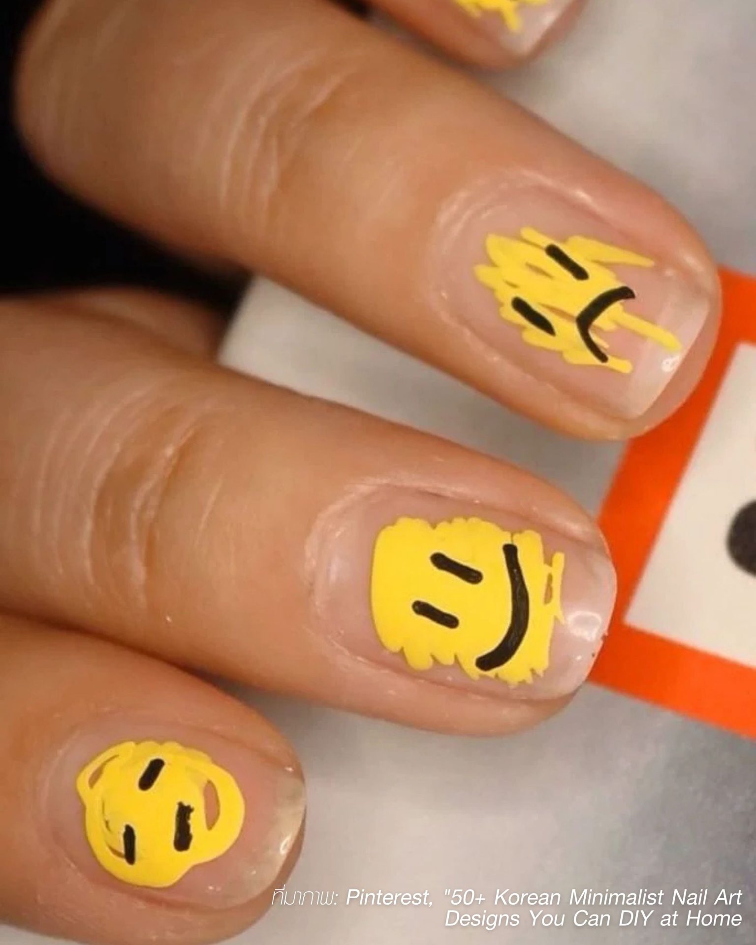 Korean style minimalist men's nails with yellow smiley faces