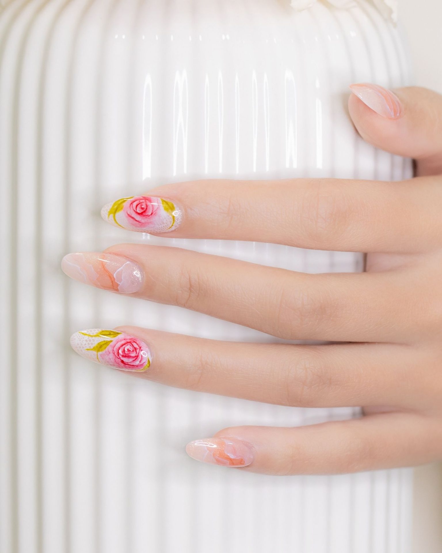 Rose nail art on marble background