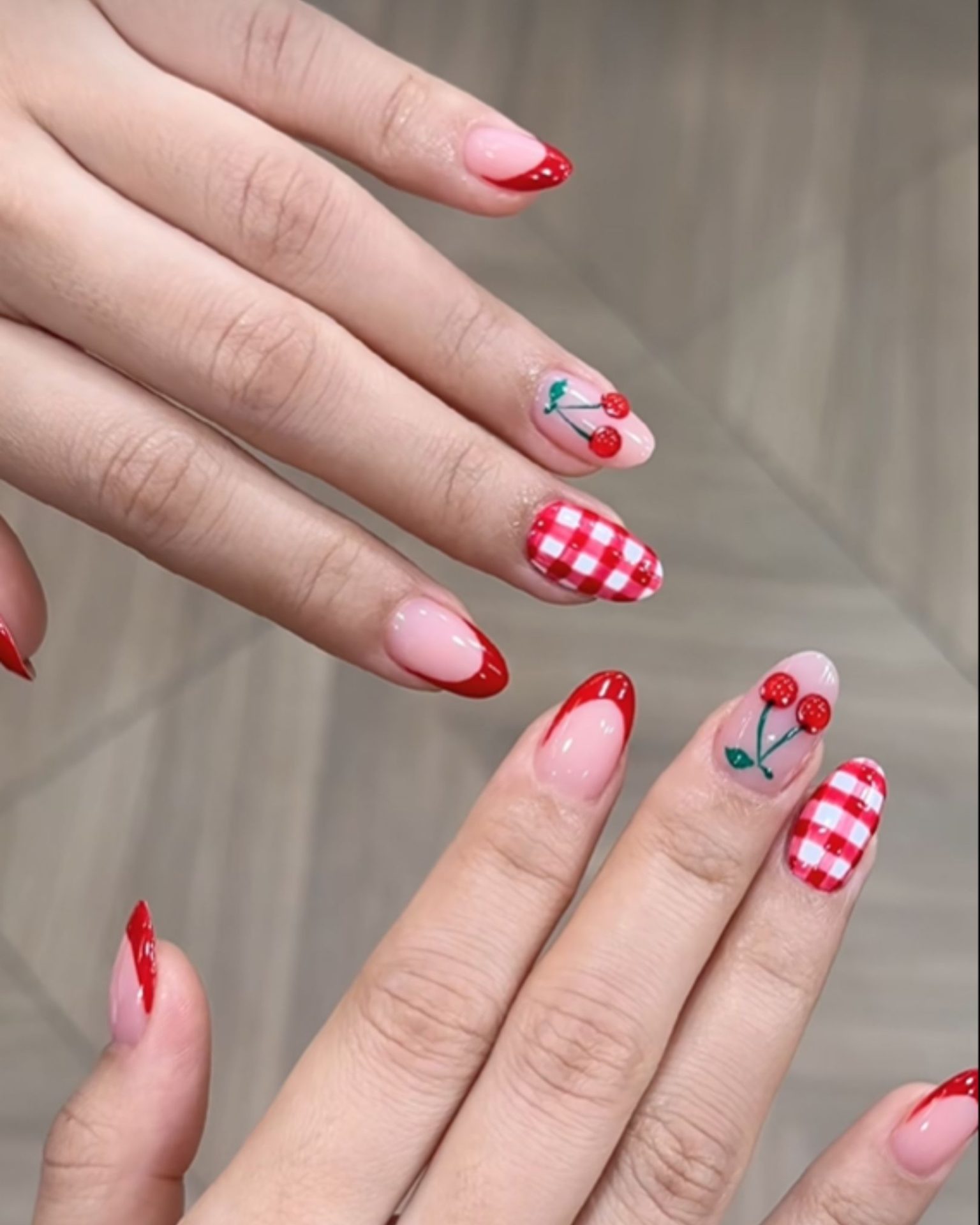 Cherry nail art with red checkerboard pattern