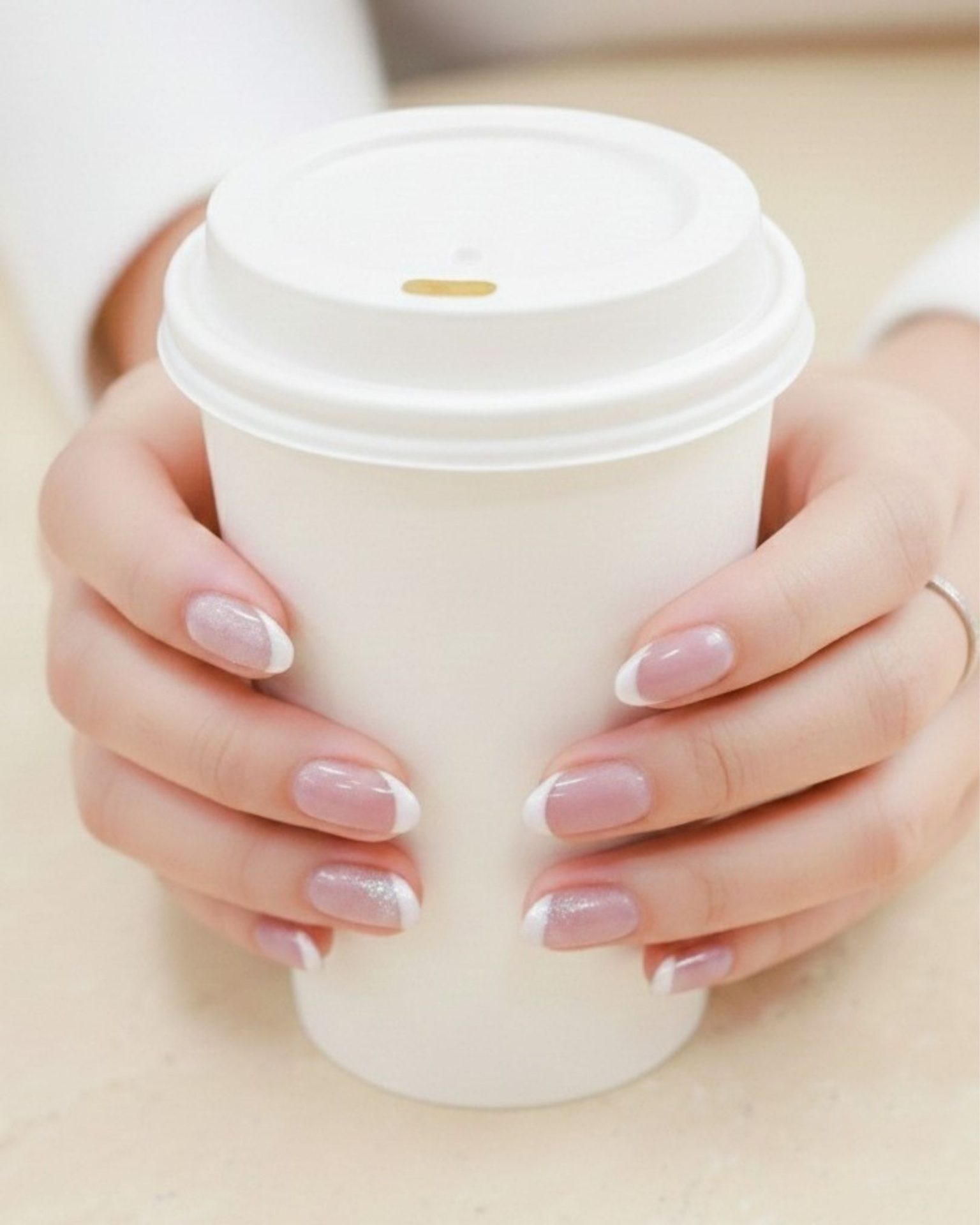 Classic French tip nail art with sparkling glitter