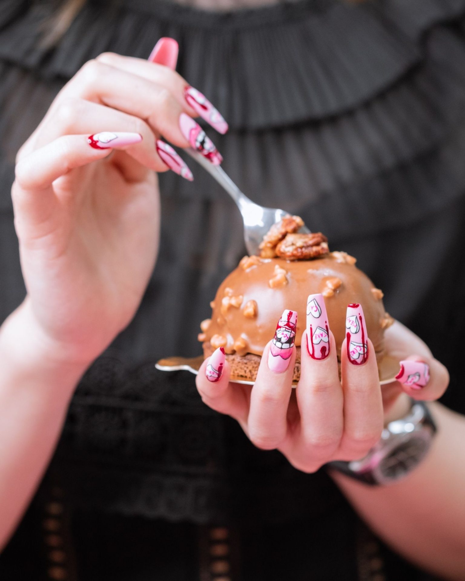 Long coffin-shaped pink nails painted with horror cartoon design, full detail, standout finish