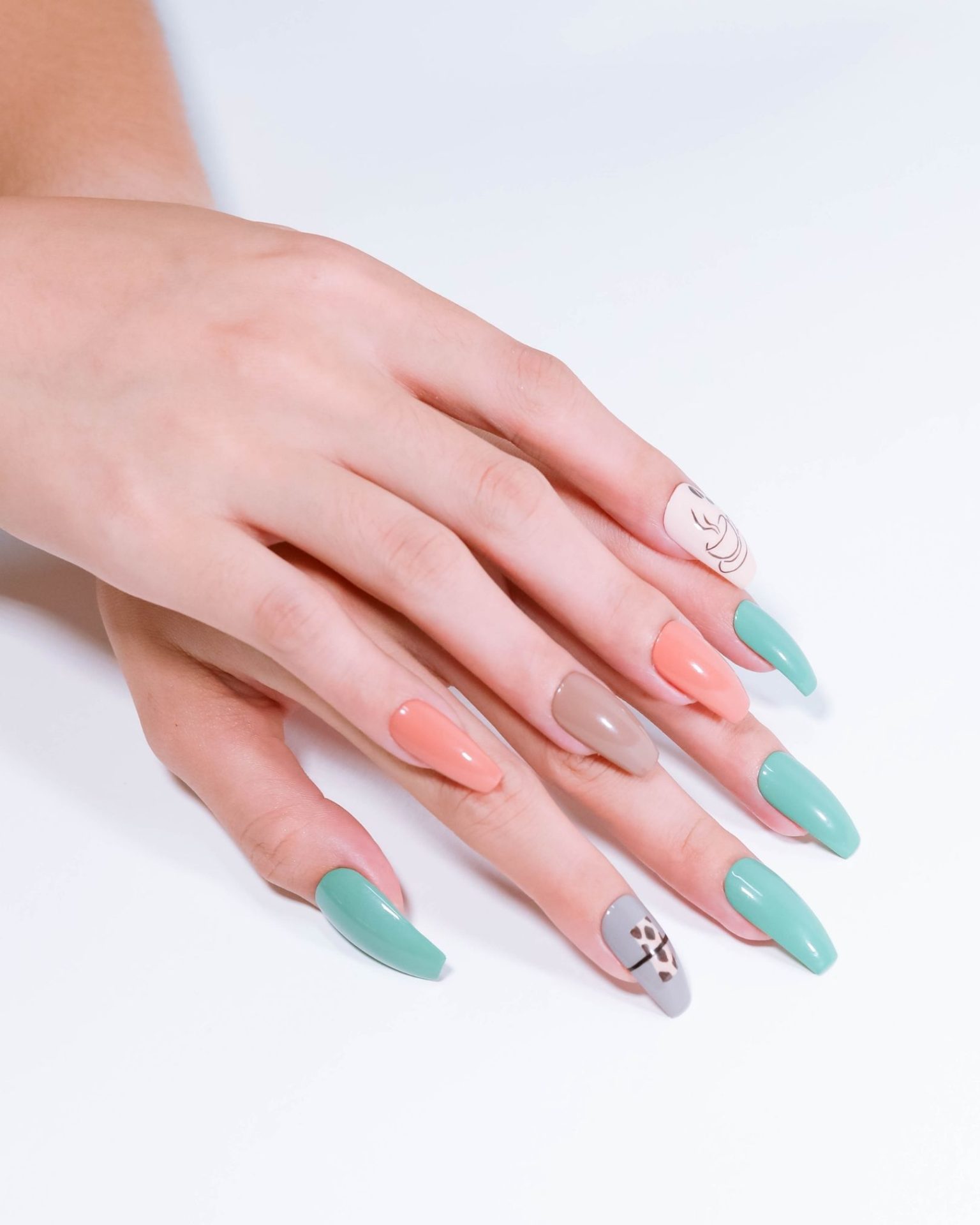 Coffin-shaped nails in multiple pastel shades, modern design with cute bright patterns, teen fashion style