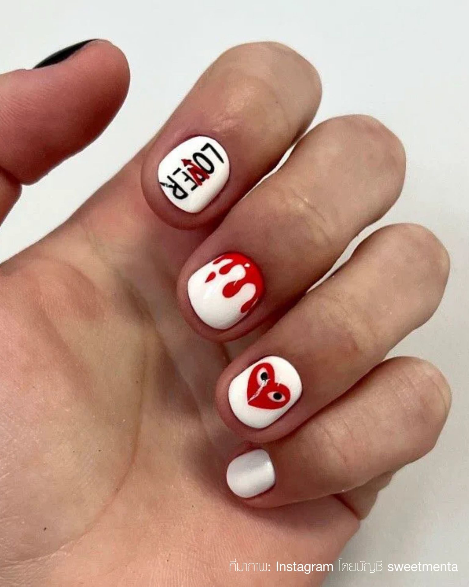 Street style nail art for men with red hearts and lettering