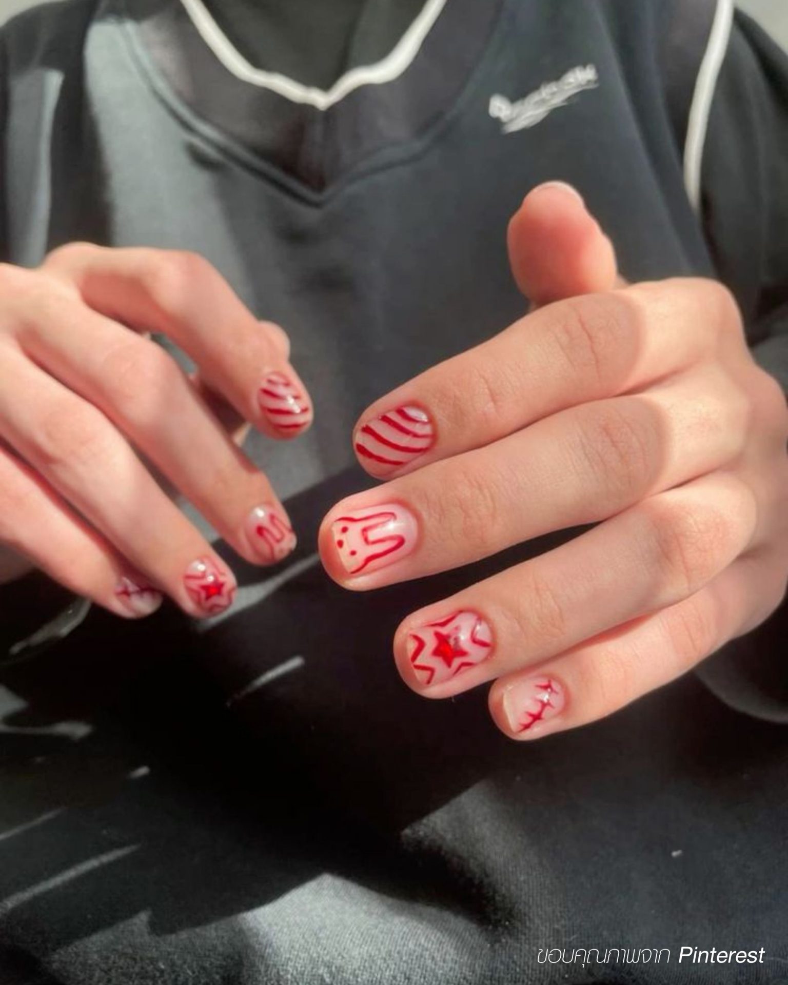 Red graphic art men's nails for a bold standout look