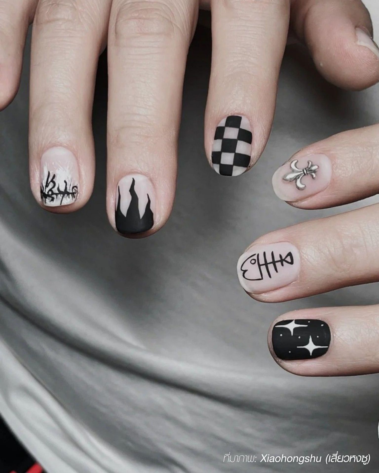 Black and white minimalist men's nails with modern graphic designs