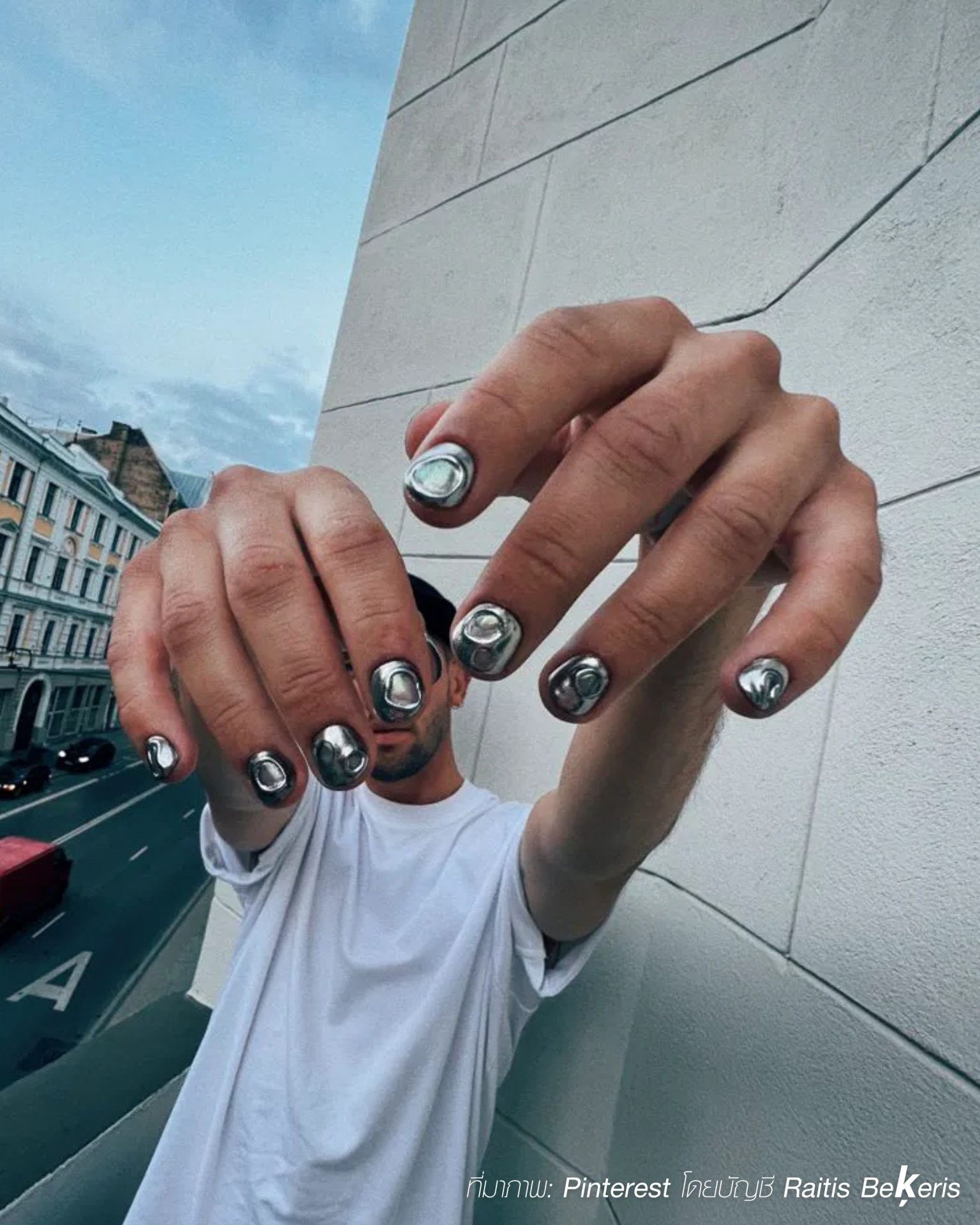 Minimalist chrome nails for men featuring sleek silver designs