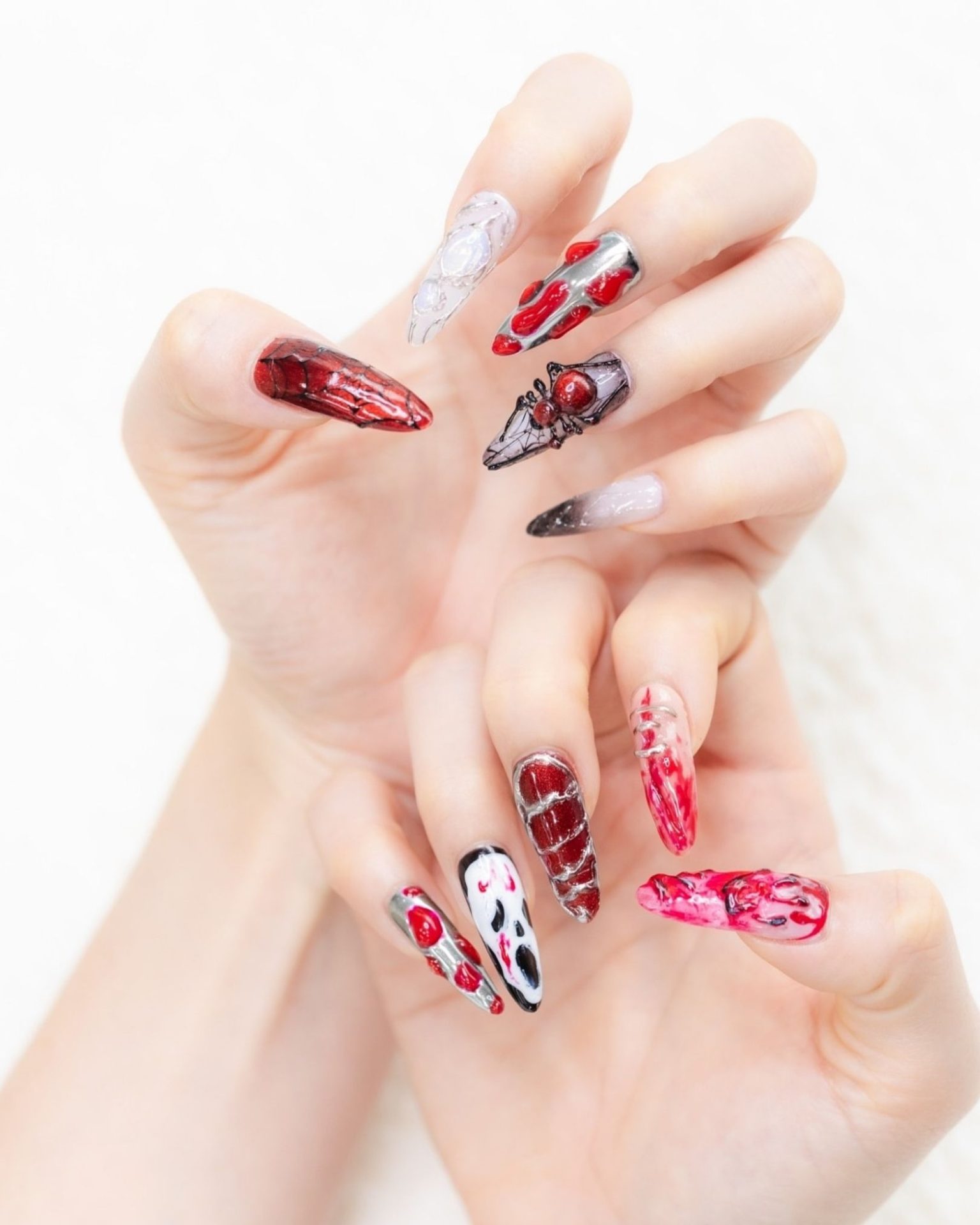 Long Halloween theme nails painted with Scream mask design