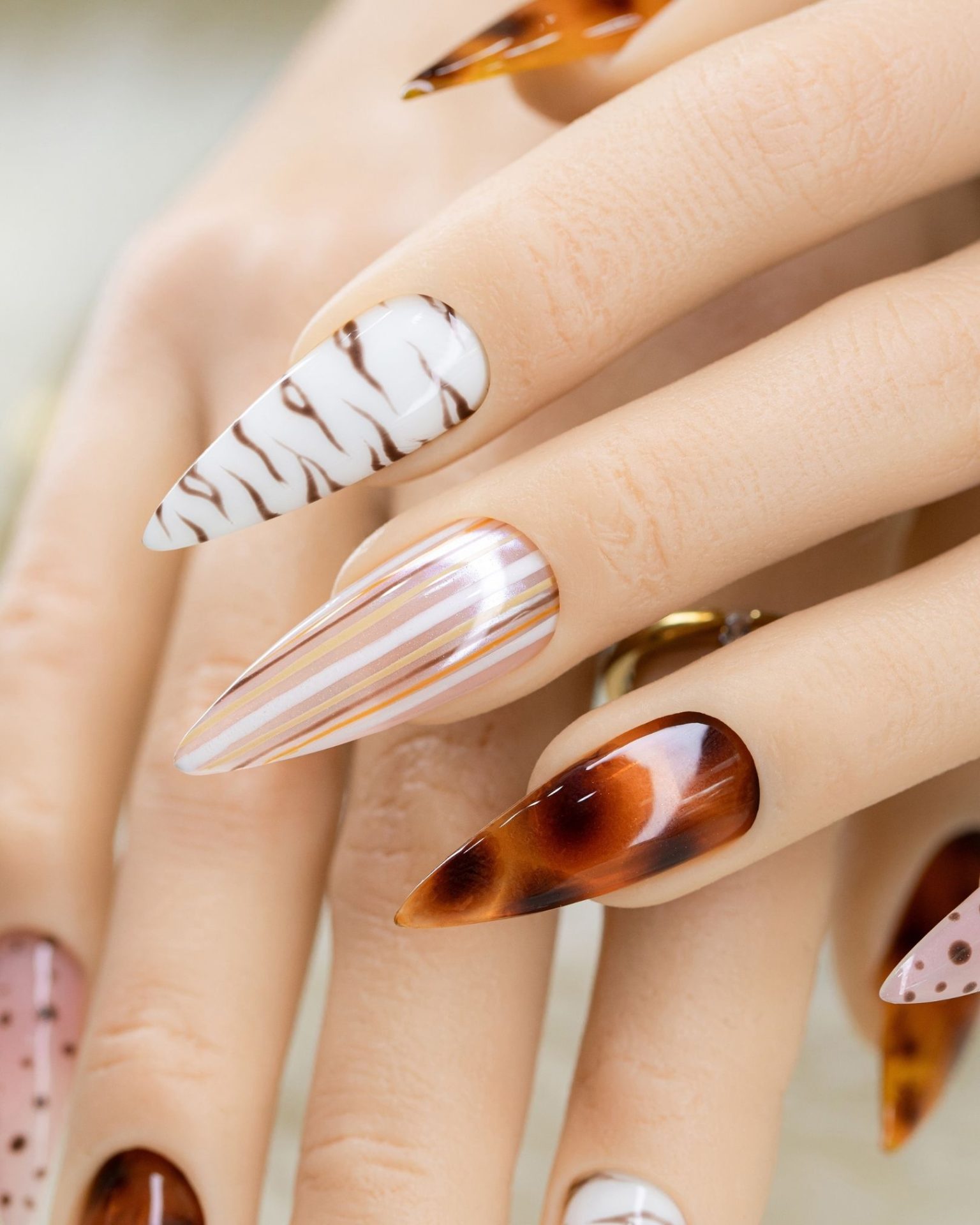 Mix-and-match nail art with leopard print, grid pattern, and tortoiseshell design