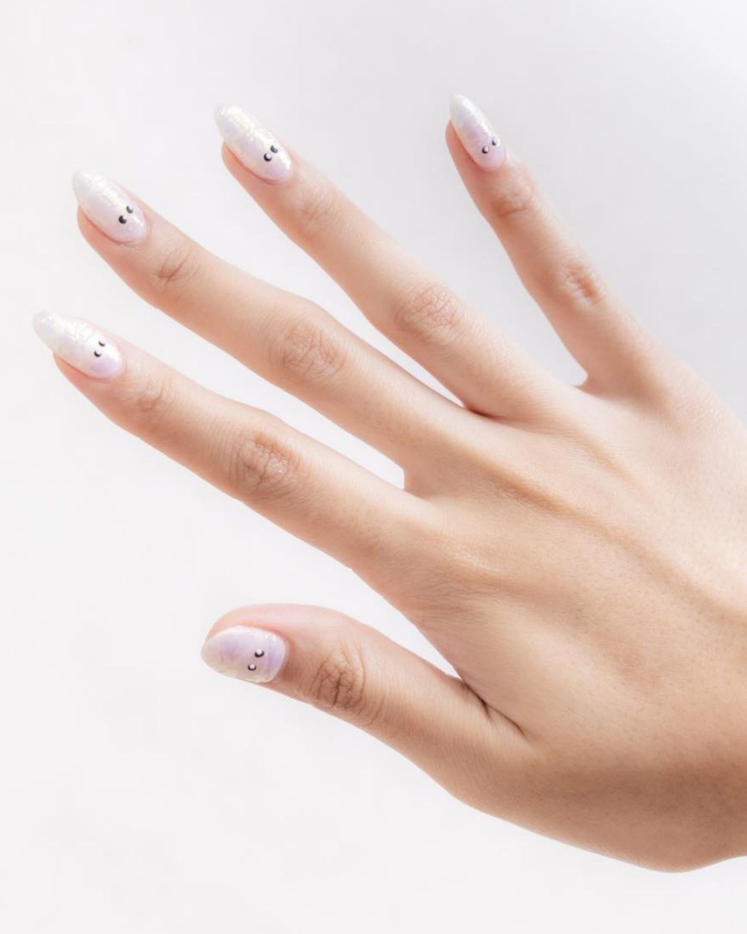 White little ghost nail art on cute shimmer surface