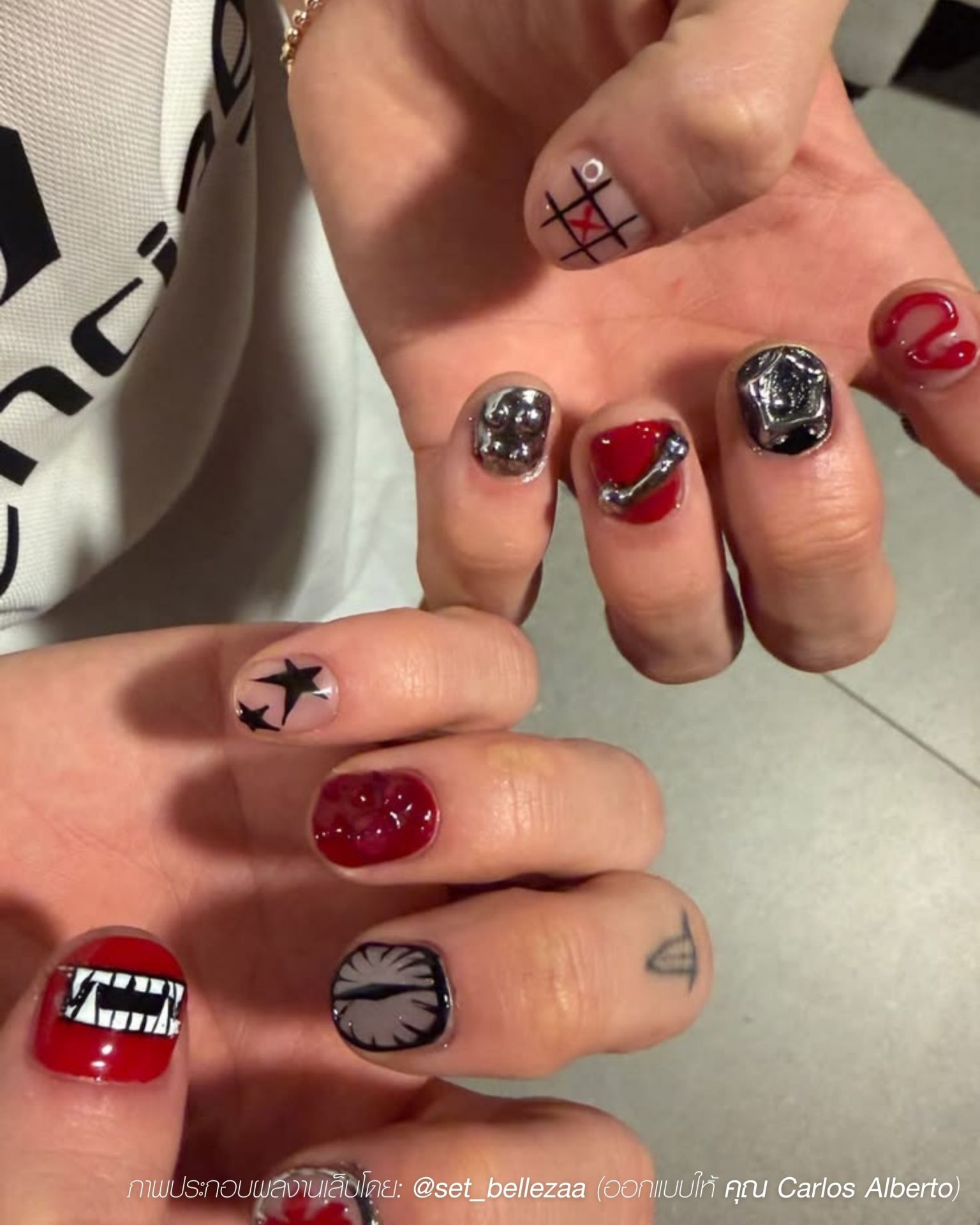 Streetwear men's nails with painted graphics and cool metal embellishments