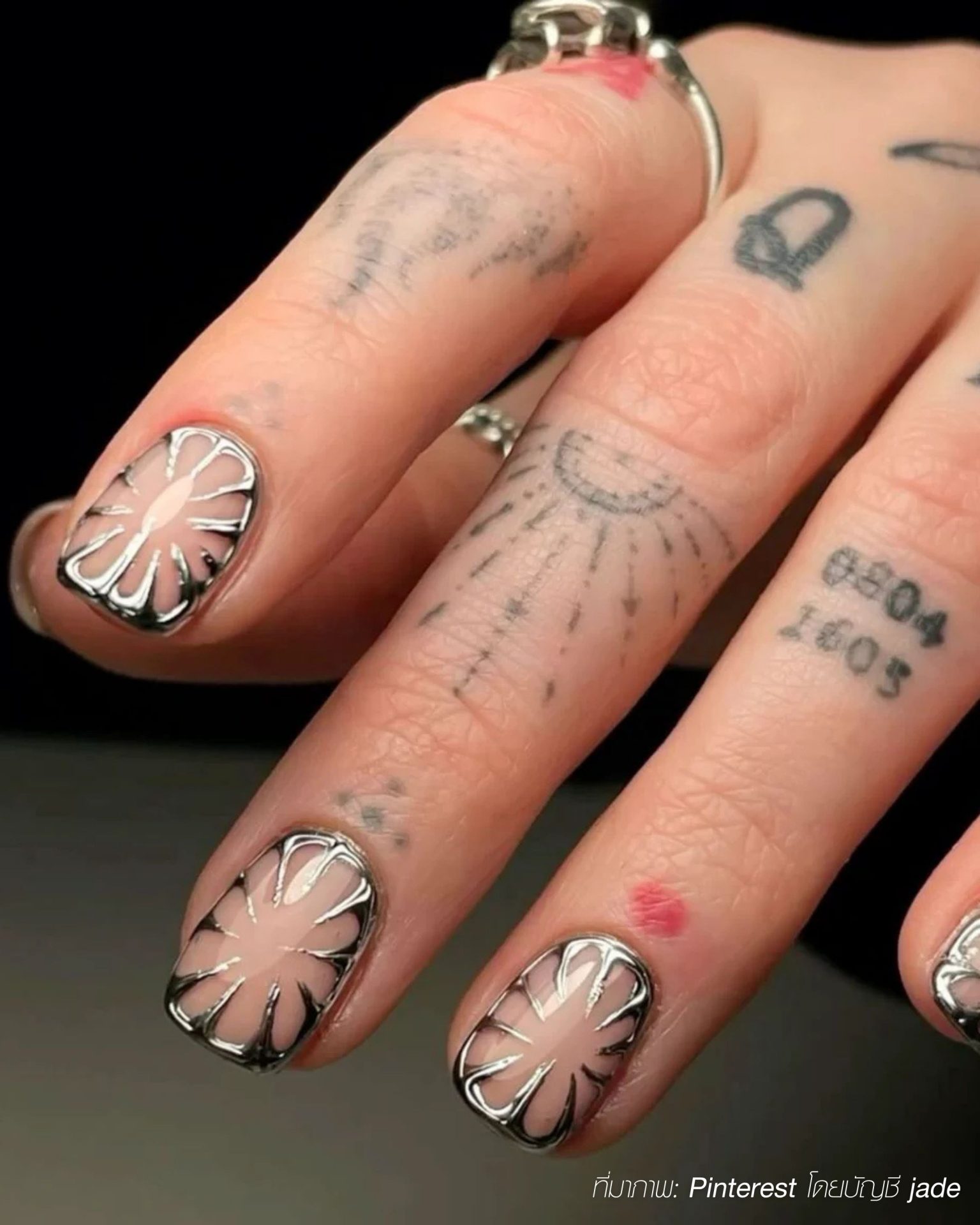 Futuristic 3D chrome nail ideas for men in metallic styles