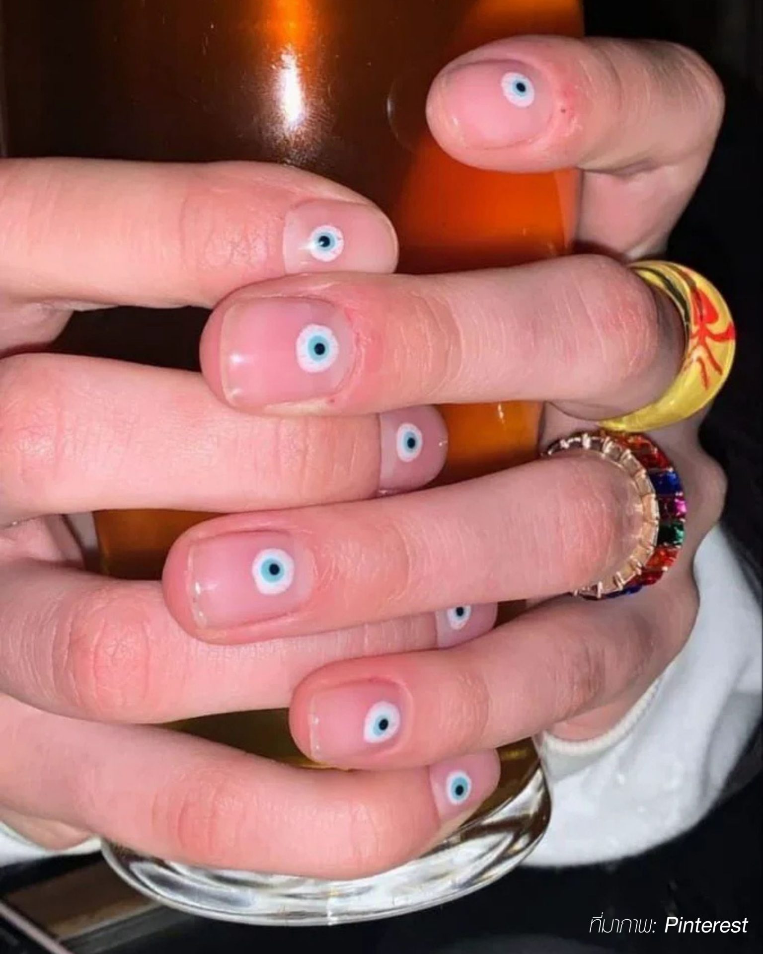 Chic eye motif painted nails to give men a standout unique look
