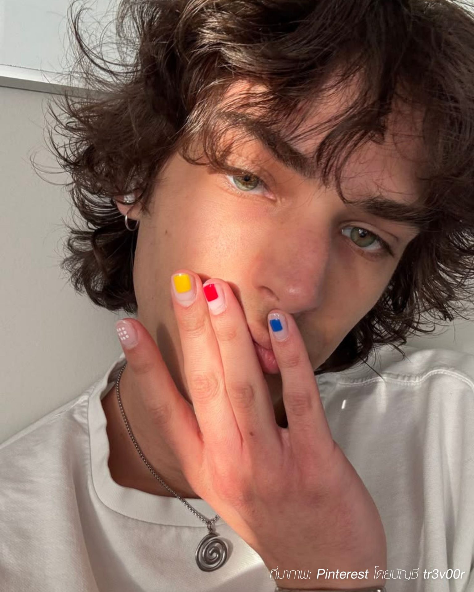 Minimalist men's nail ideas highlighting colorful blocks with white outlines