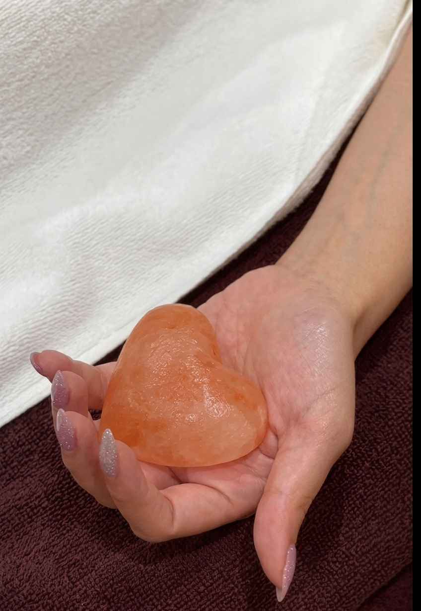 Pink-orange Himalayan salt stones, the raw material for stress-relieving hot stone massage
