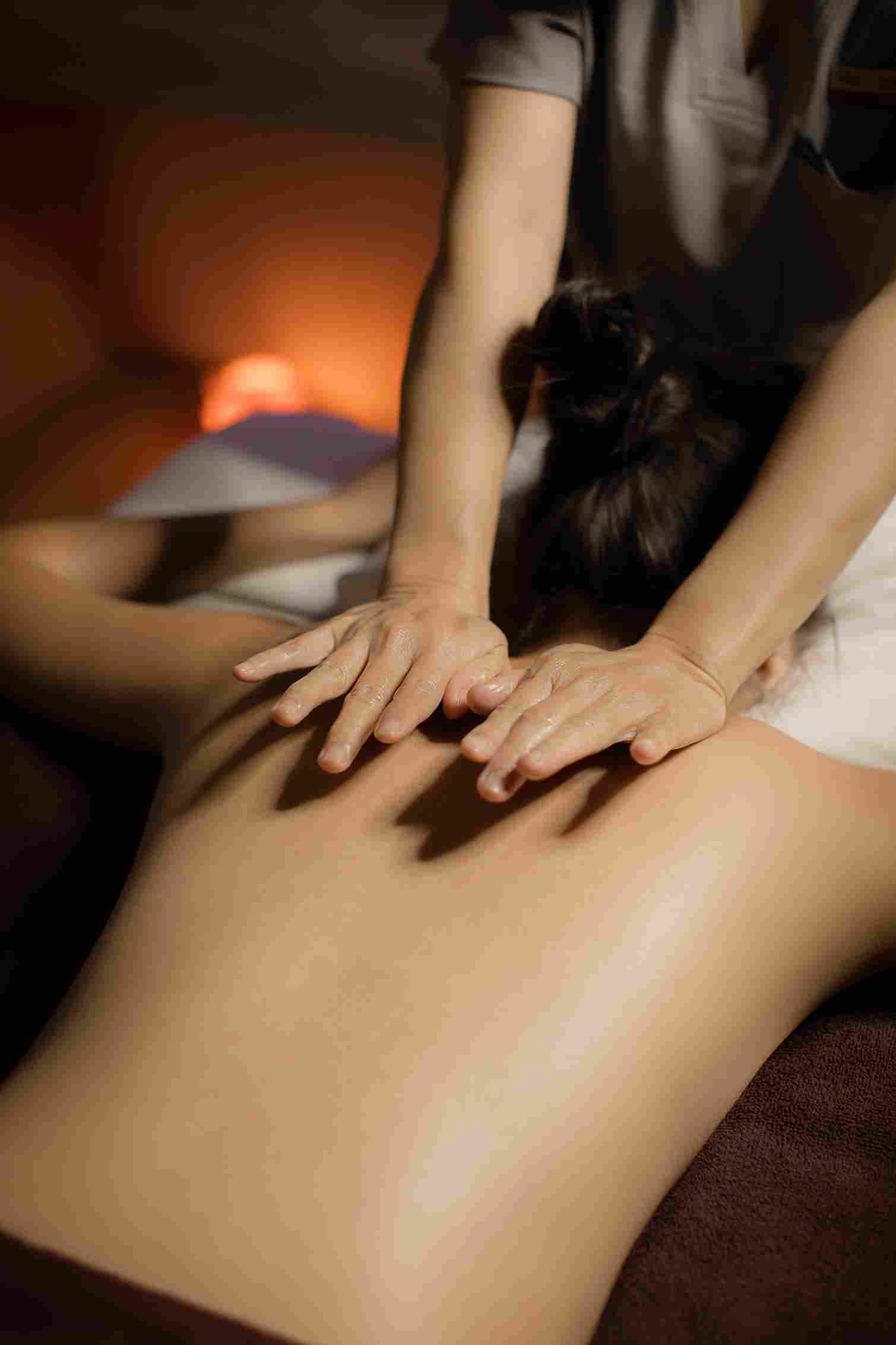 Assisted stretching during a sports massage to improve flexibility and range of motion