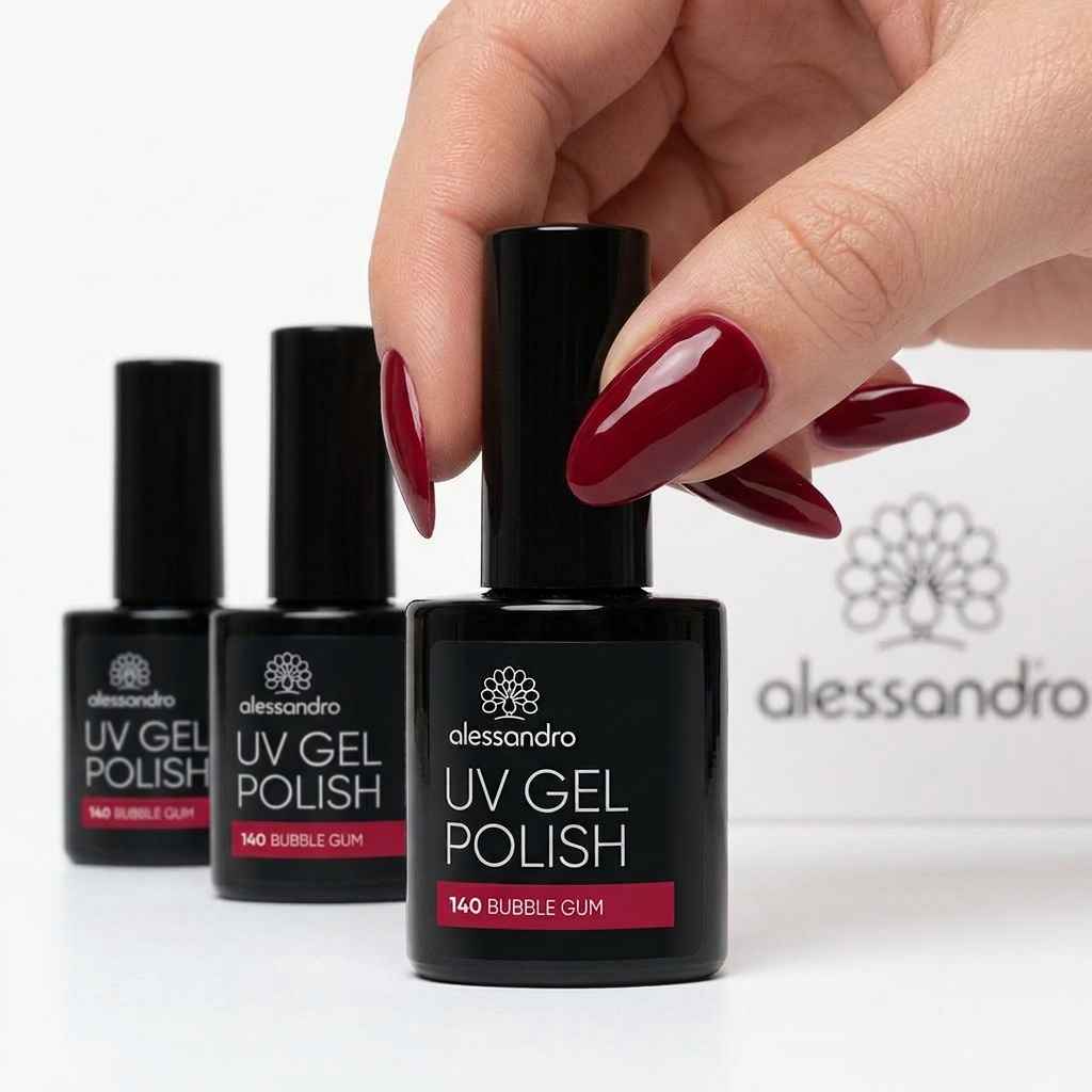Hand with gel polish nails holding an Alessandro UV Gel Polish 10 ml bottle in shade 140 Dubble Gum