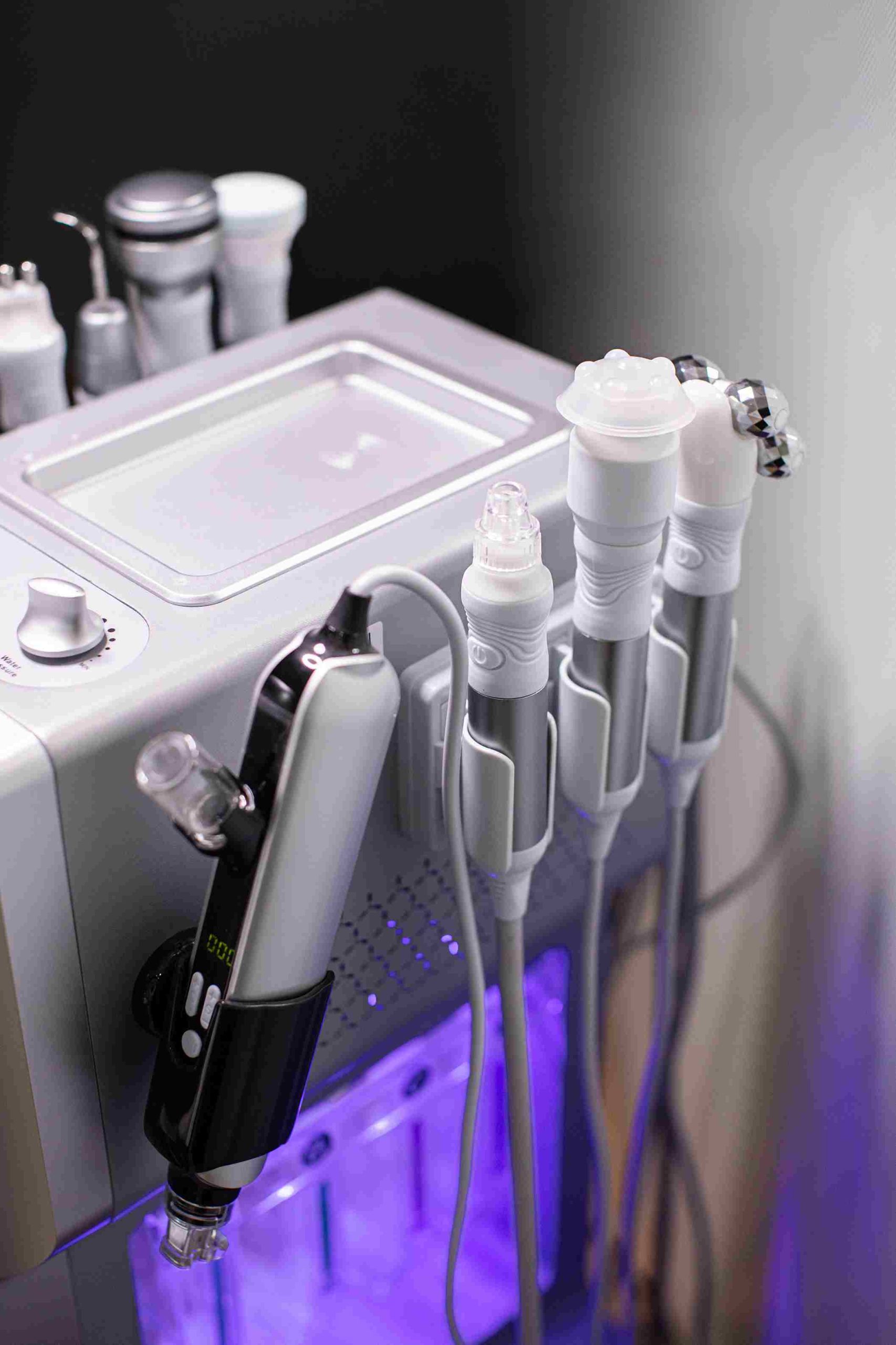 Close-up of the 9 treatment heads on the Hydra Facial 9 in 1 machine